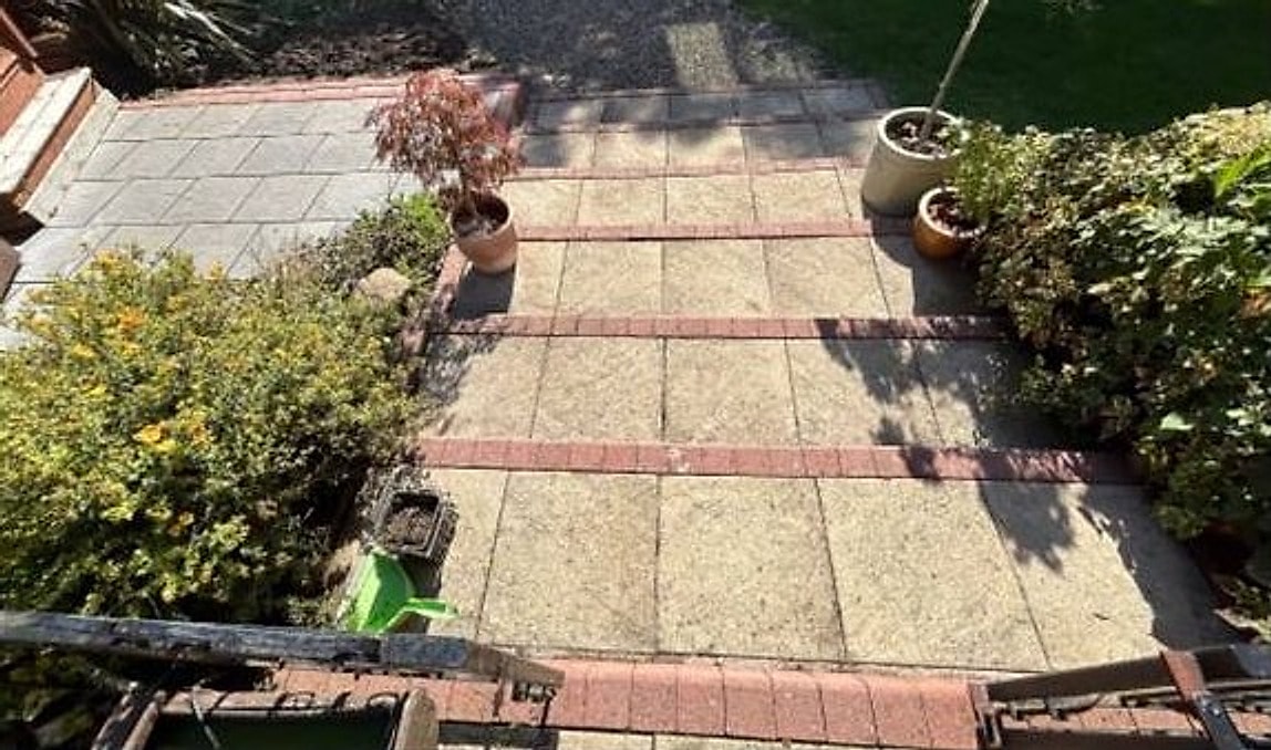 The same patio cleaned back to bright, even stone